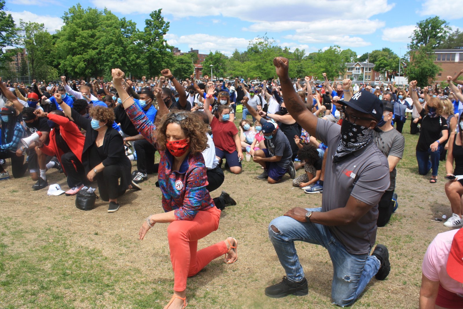 Montrealers  march and kneel against racism